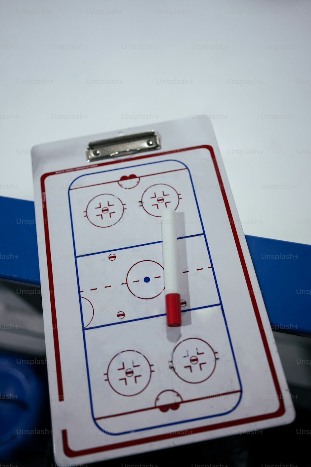 a clipboard with a hockey game on it