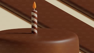 un gâteau au chocolat avec une seule bougie dessus