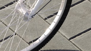 a close up of the spokes of a bicycle