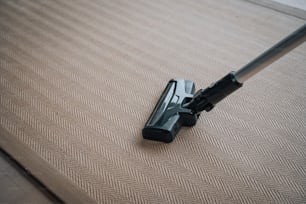 a close up of a vacuum cleaner on a carpet