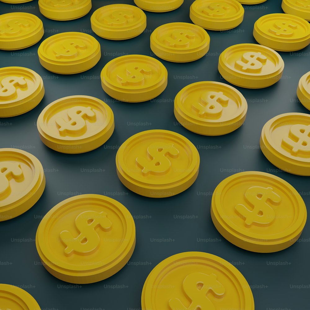 a bunch of yellow bitcoins sitting on top of a table