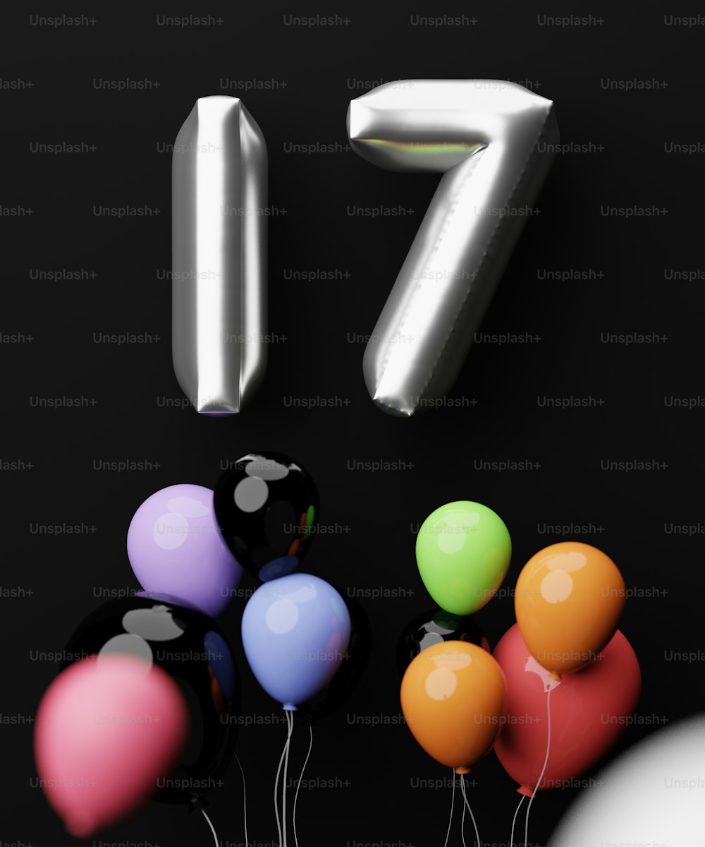 a group of balloons with the number seven on them
