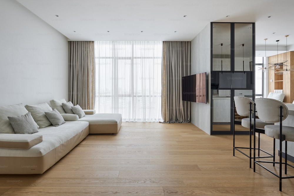 a living room filled with furniture and a flat screen tv