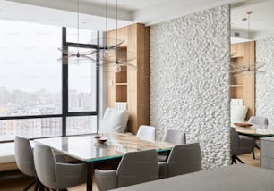 a modern dining room with a view of the city