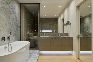 a bath room with a bath tub a sink and a mirror
