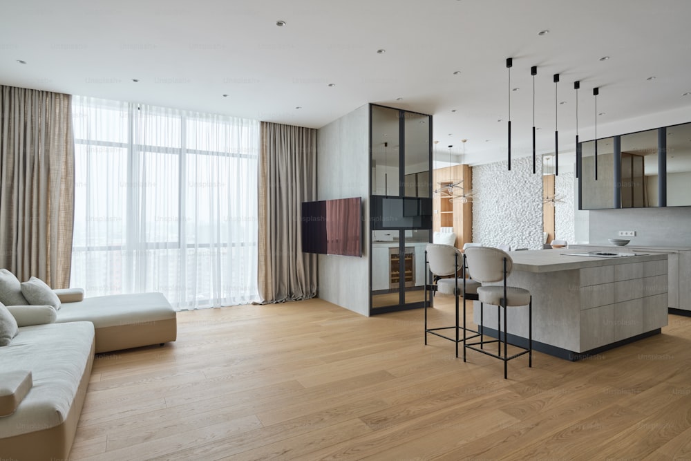 a living room filled with furniture and a flat screen tv