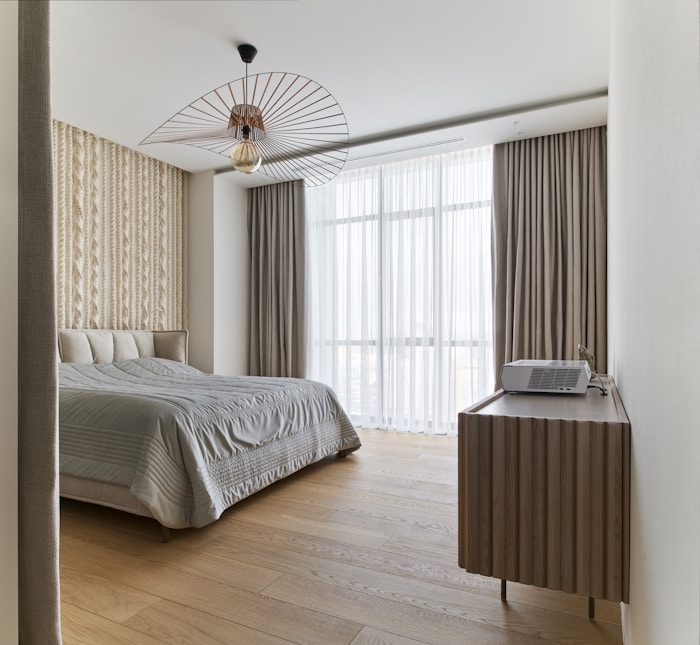 Curtains framing a bedroom window