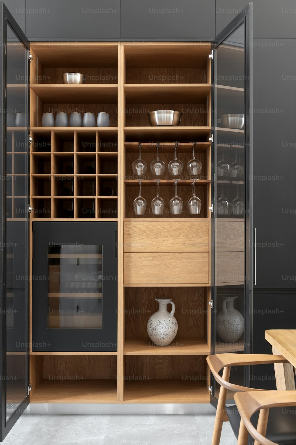 a kitchen with a wine rack and wine glasses
