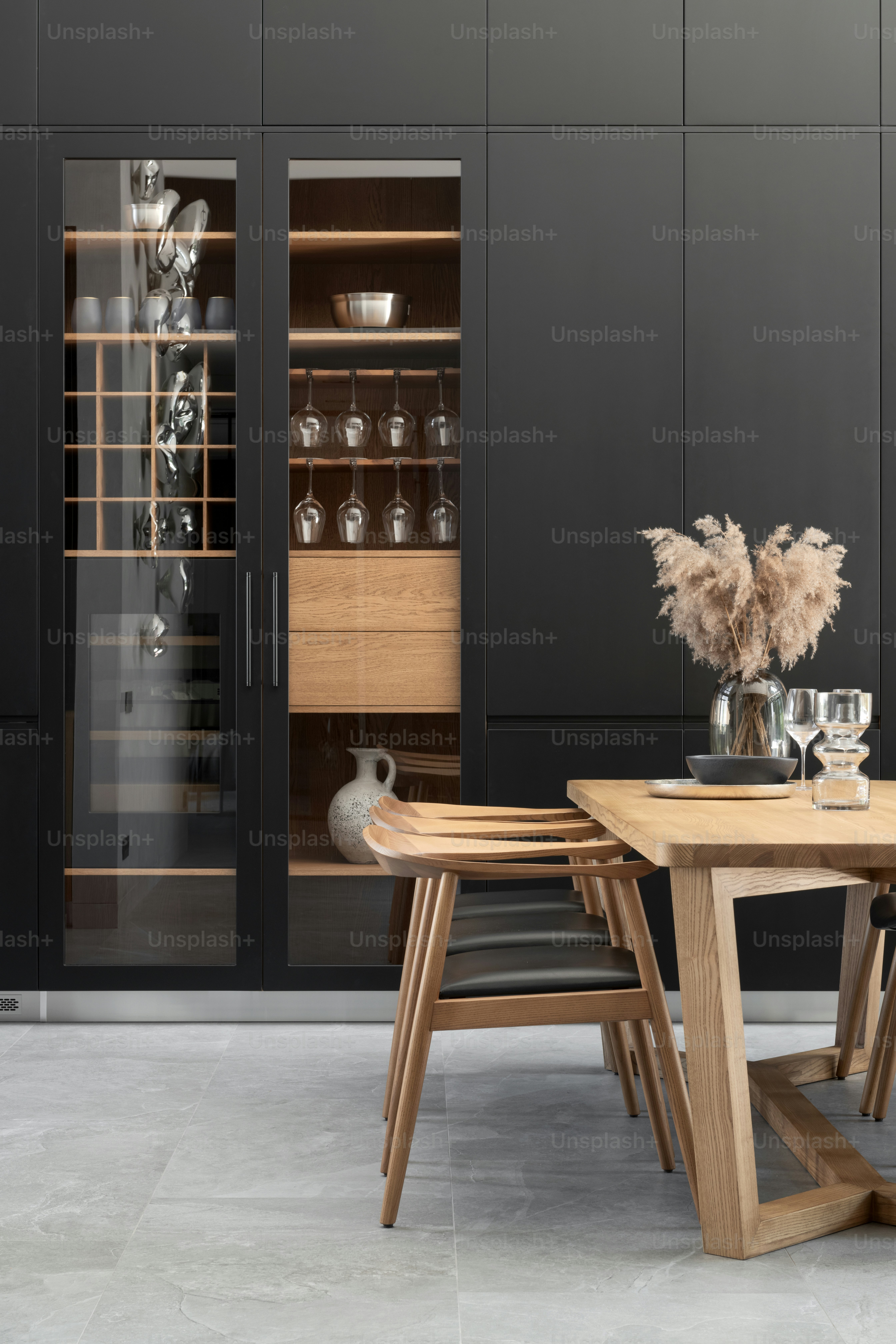 a dining room with a table and chairs