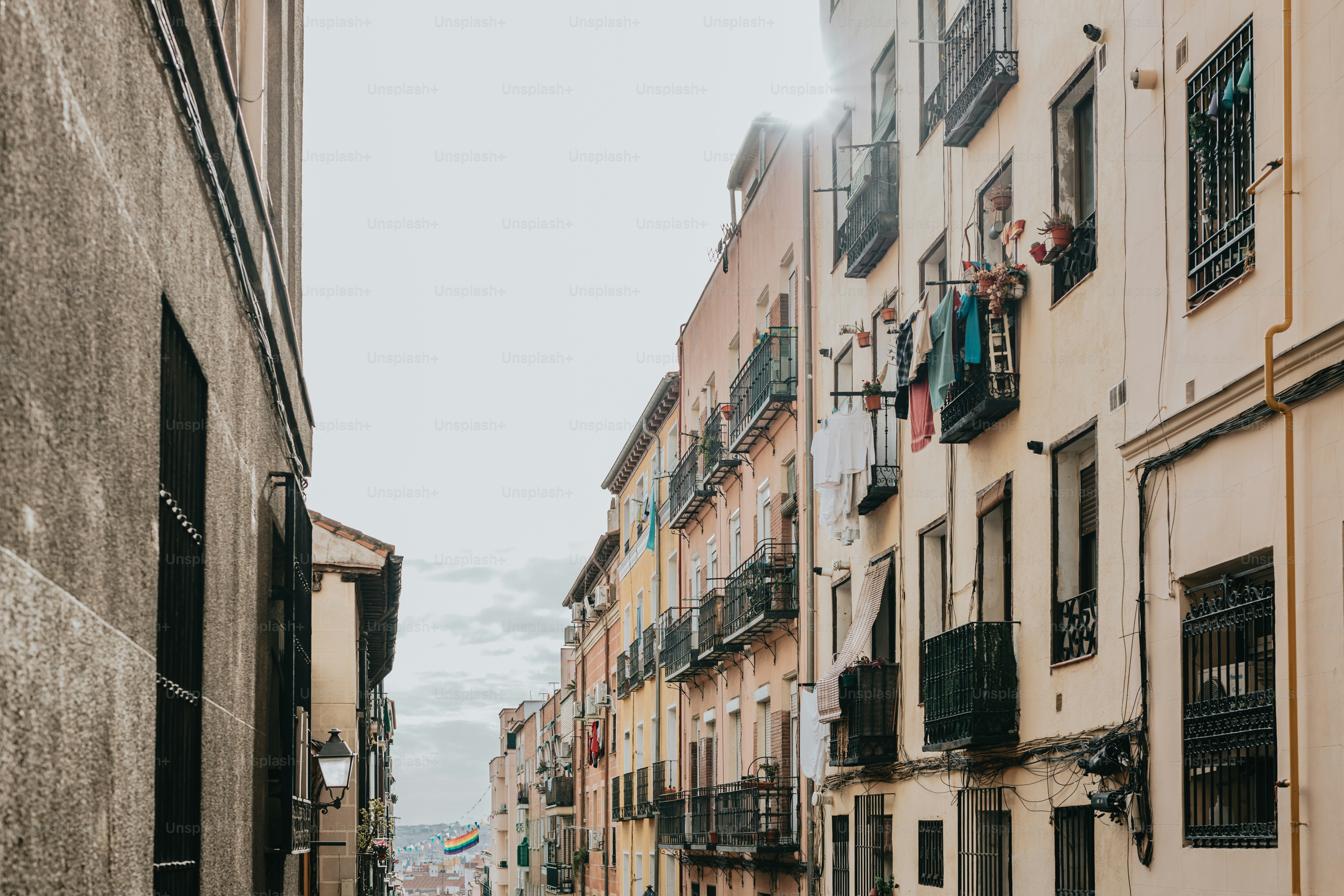 a narrow city street lined with tall buildings