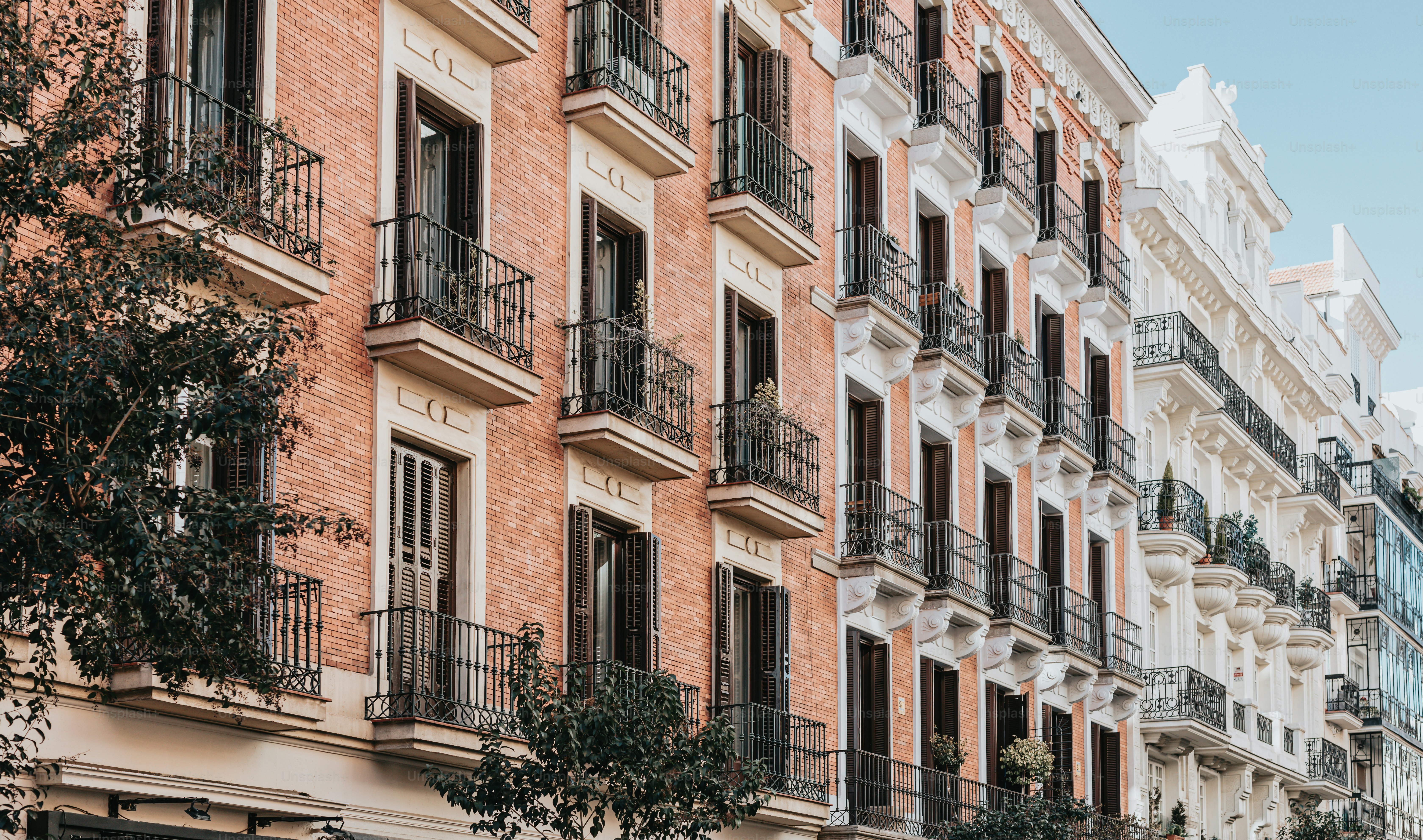 a row of brick buildings with balconies and balconies
