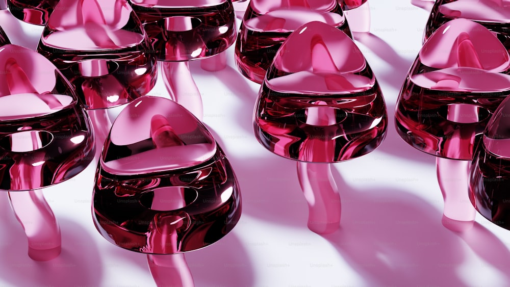 a group of pink vases sitting next to each other