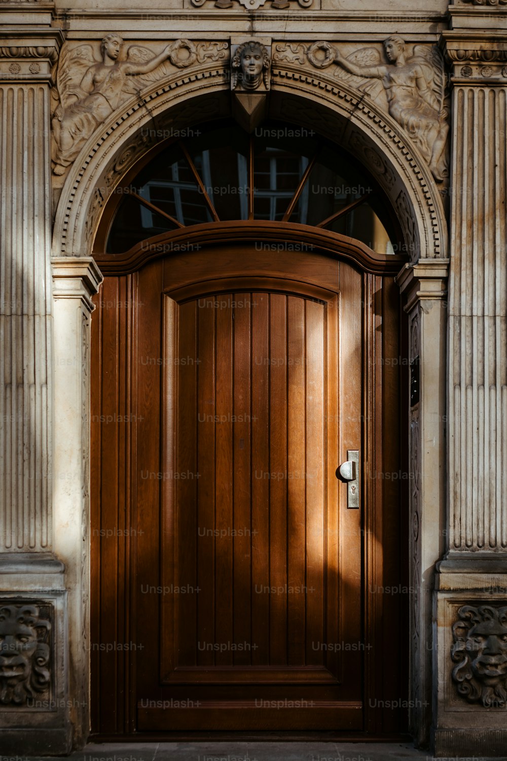 a wooden door with a clock on the side of it