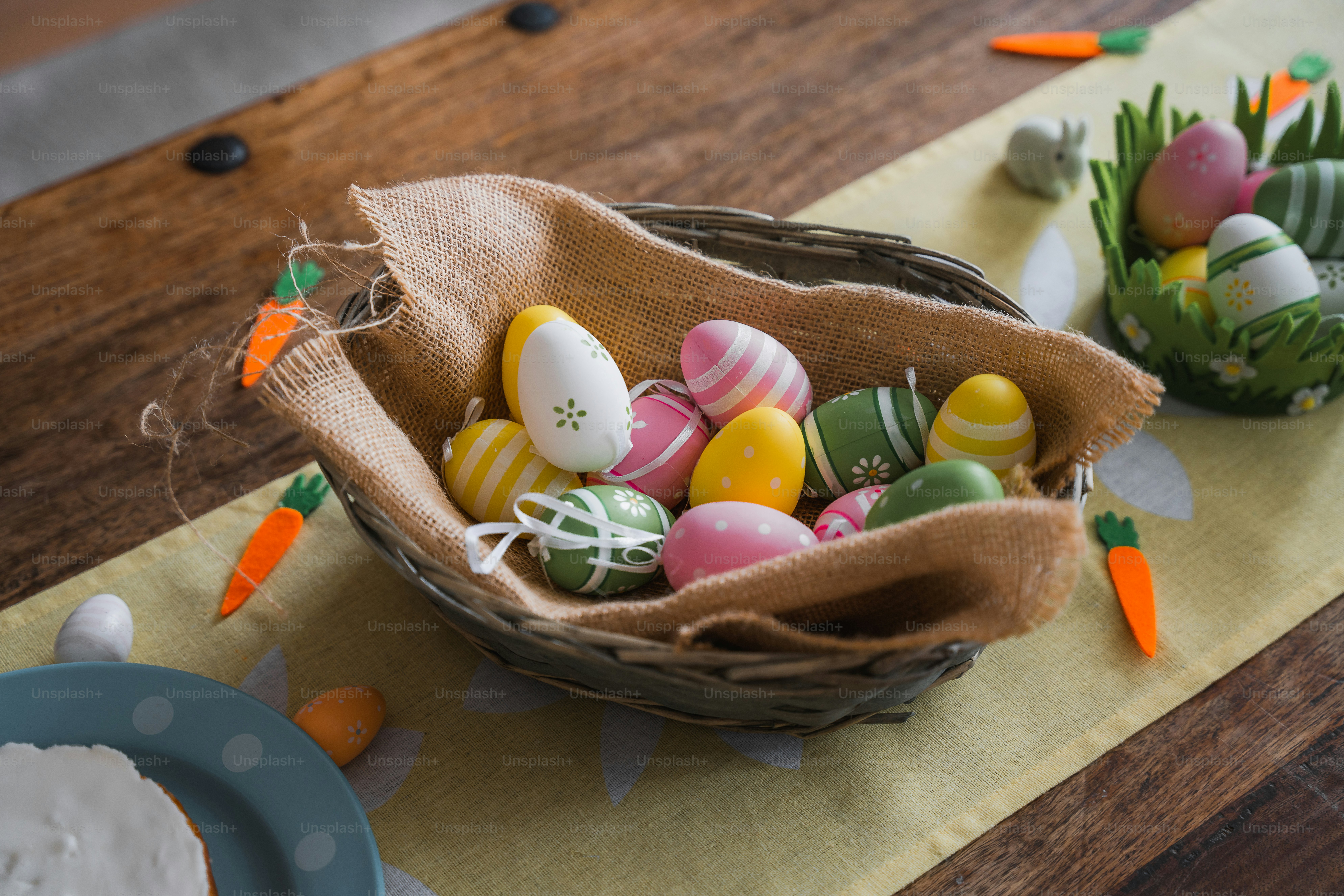 a basket of decorated eggs on a table