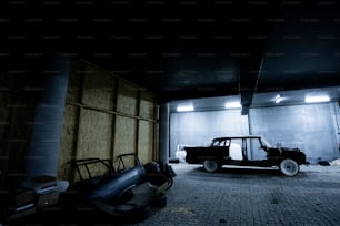 a black truck parked in a garage next to a wall