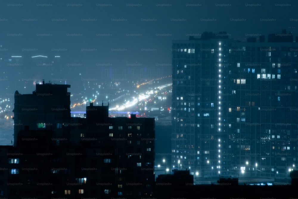 a view of a city at night from the top of a building