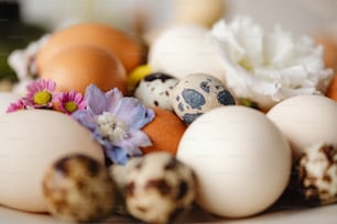 a close up of eggs and flowers on a table