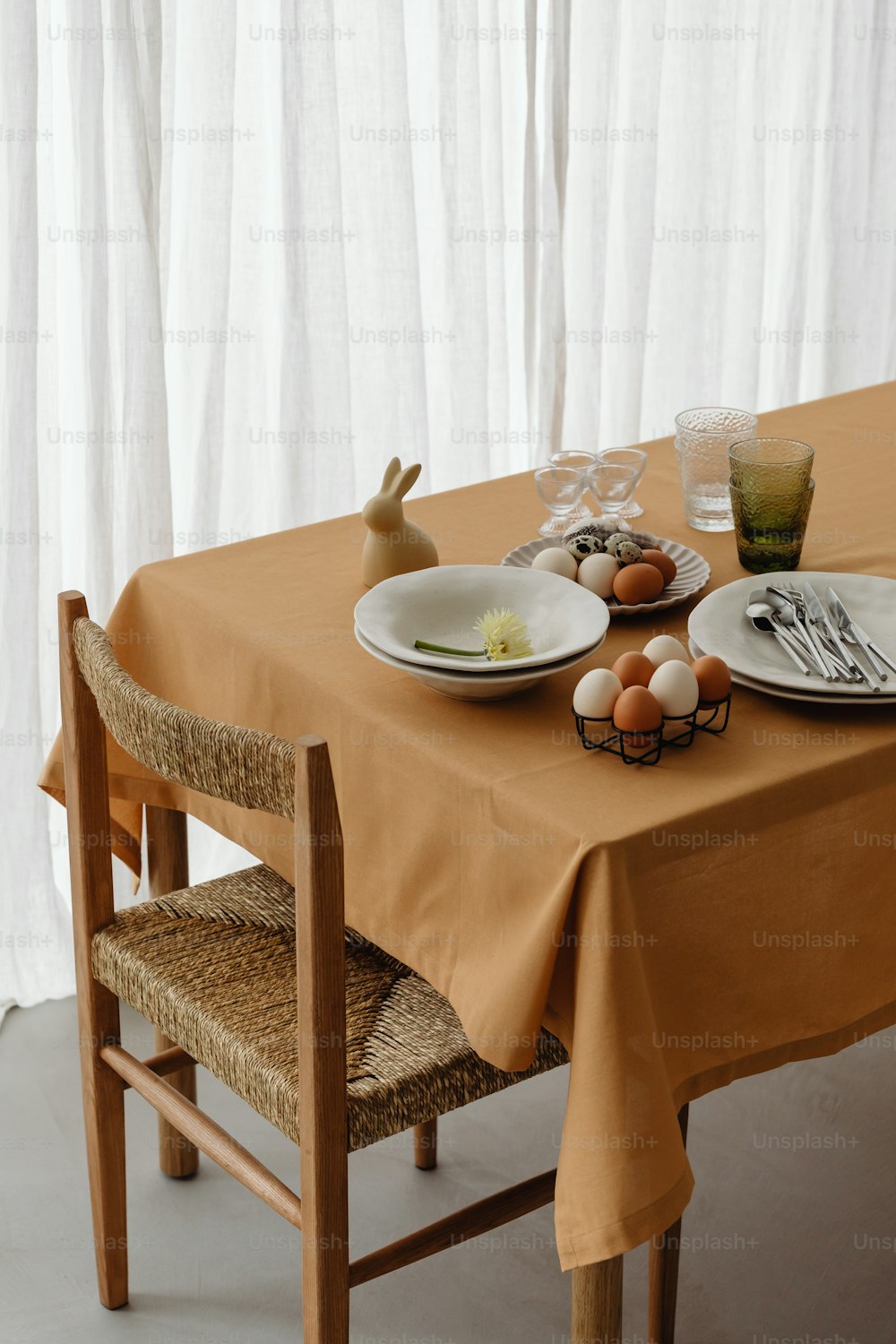 a table with plates and bowls on it