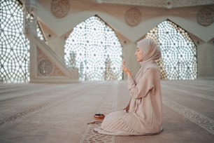 a woman sitting on the floor of a building