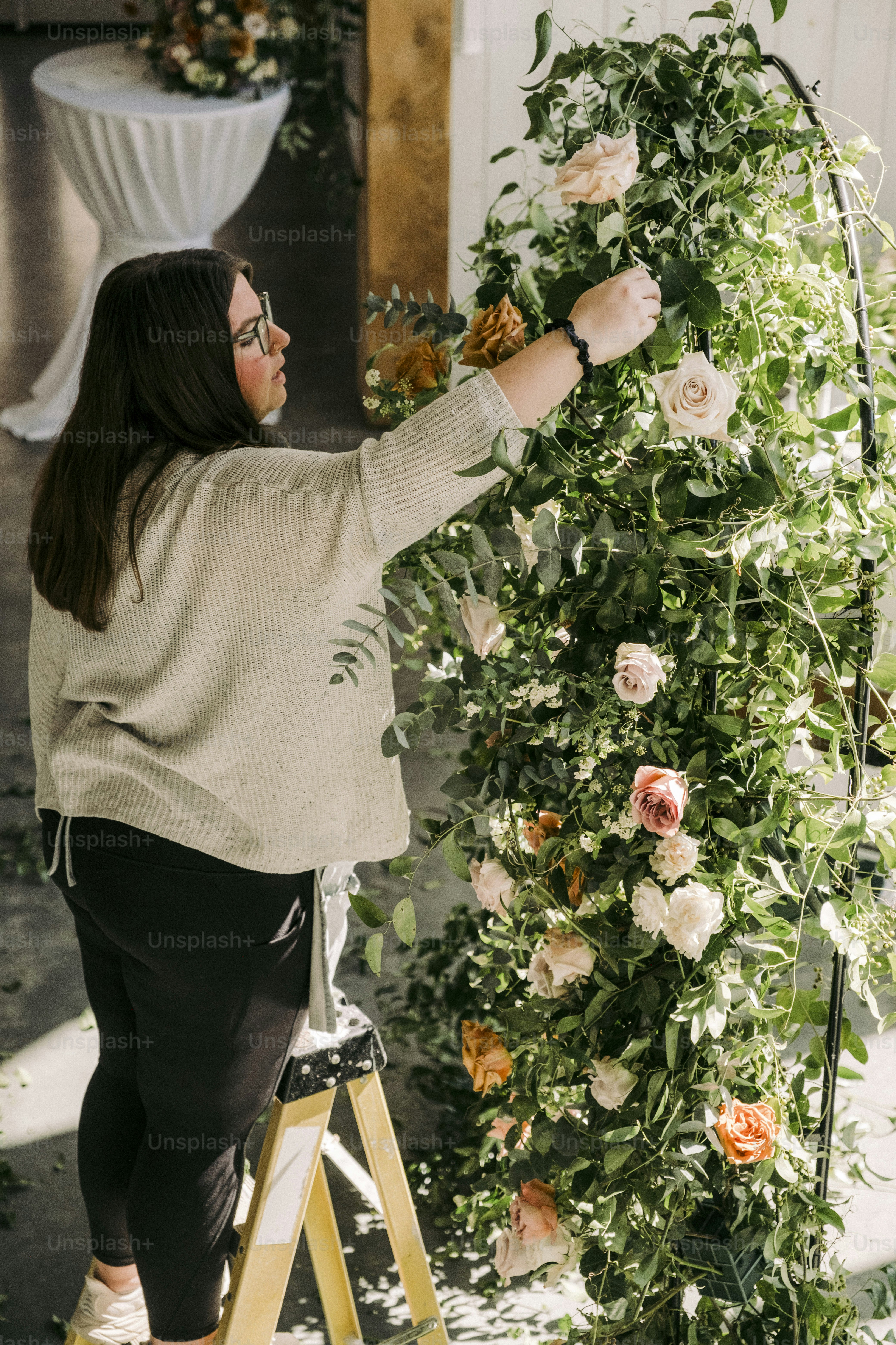 Business event flowers incorporated into branded corporate installation