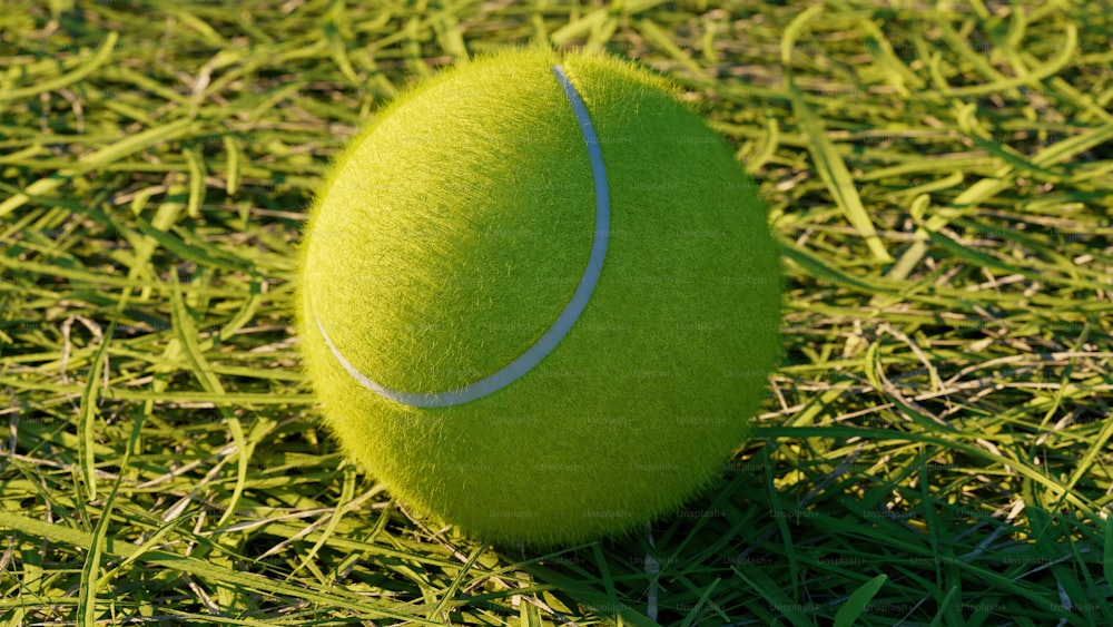 a tennis ball sitting on top of a lush green field