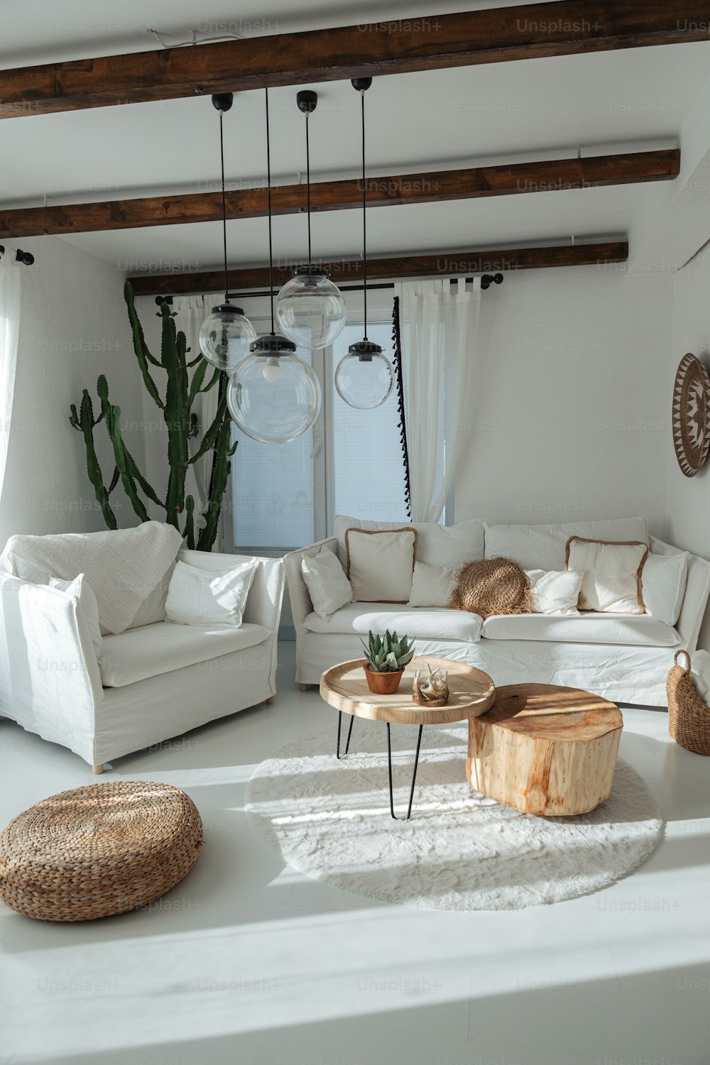 a living room filled with furniture and a large window