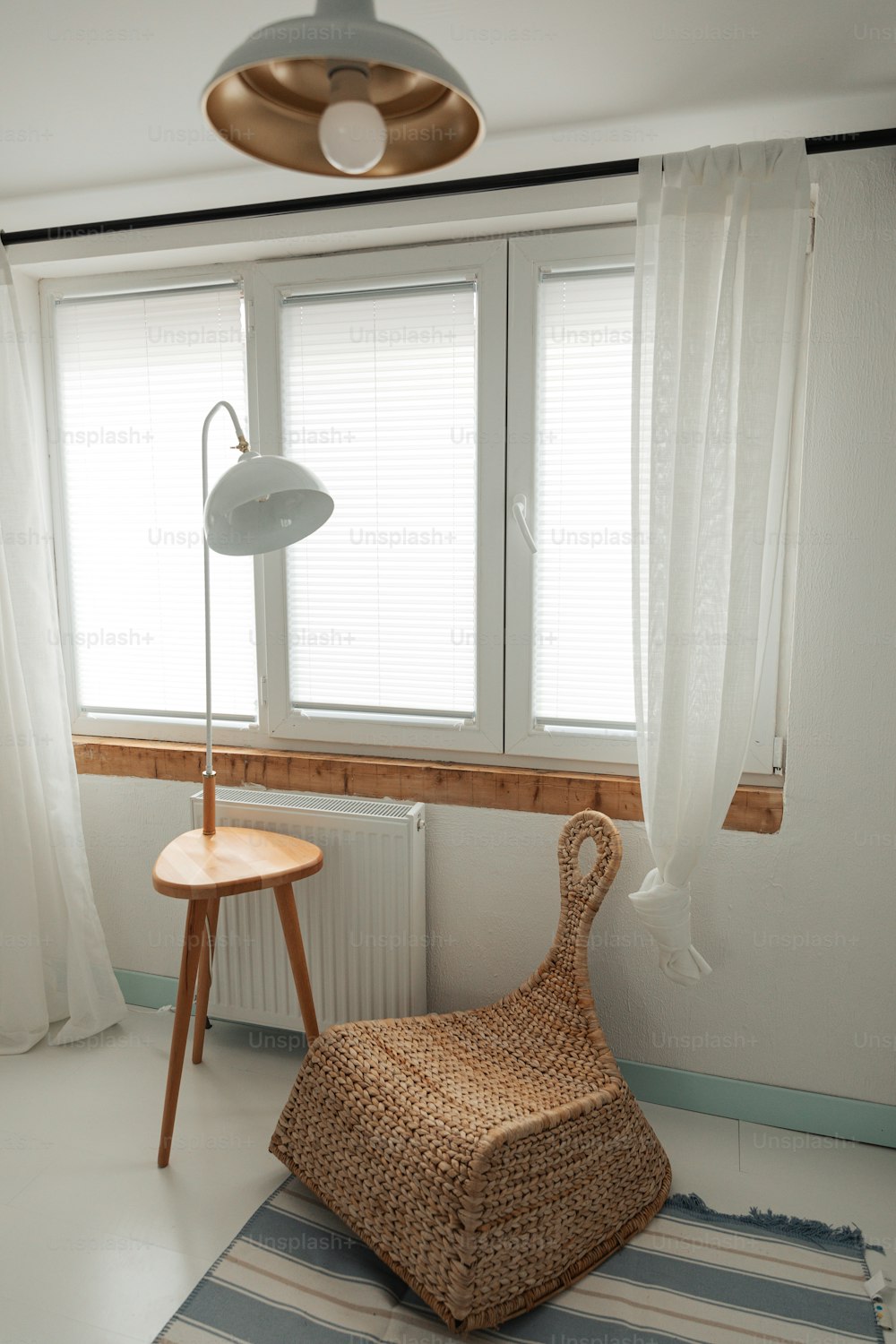 a room with a chair and a lamp in it