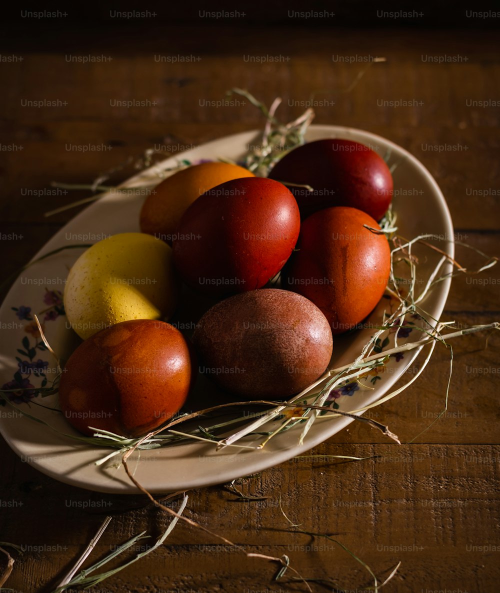 a white bowl filled with eggs on top of a wooden table