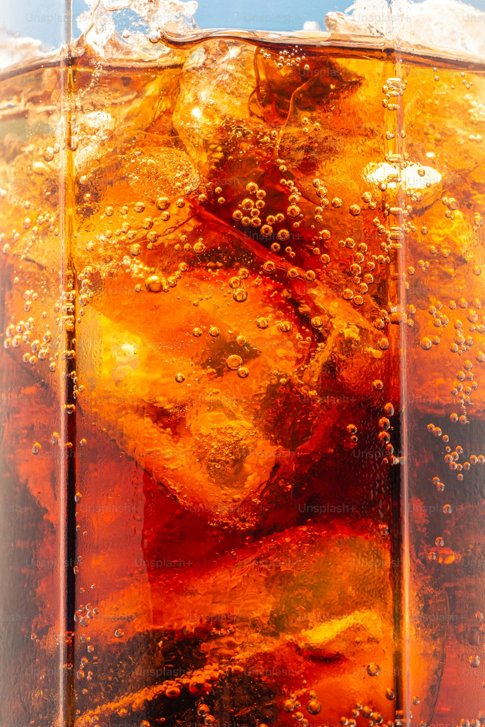 a close up of a glass of soda