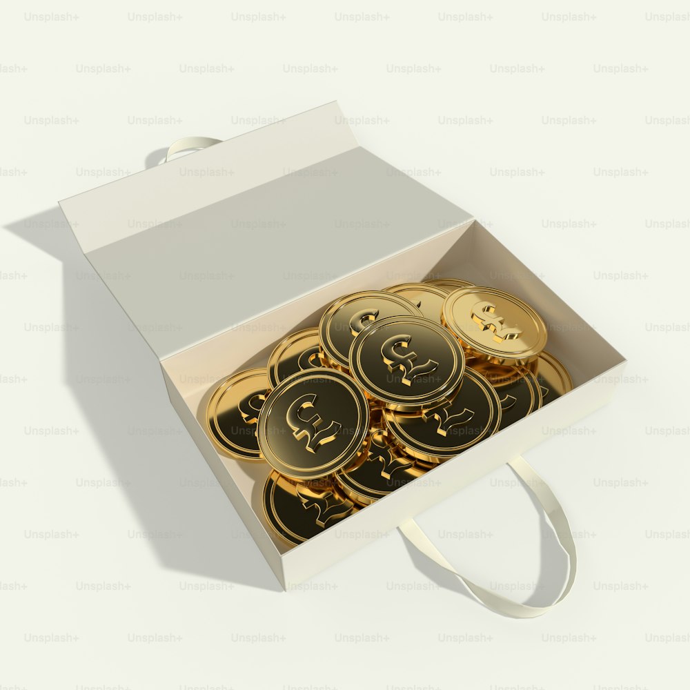 a white box filled with lots of gold coins