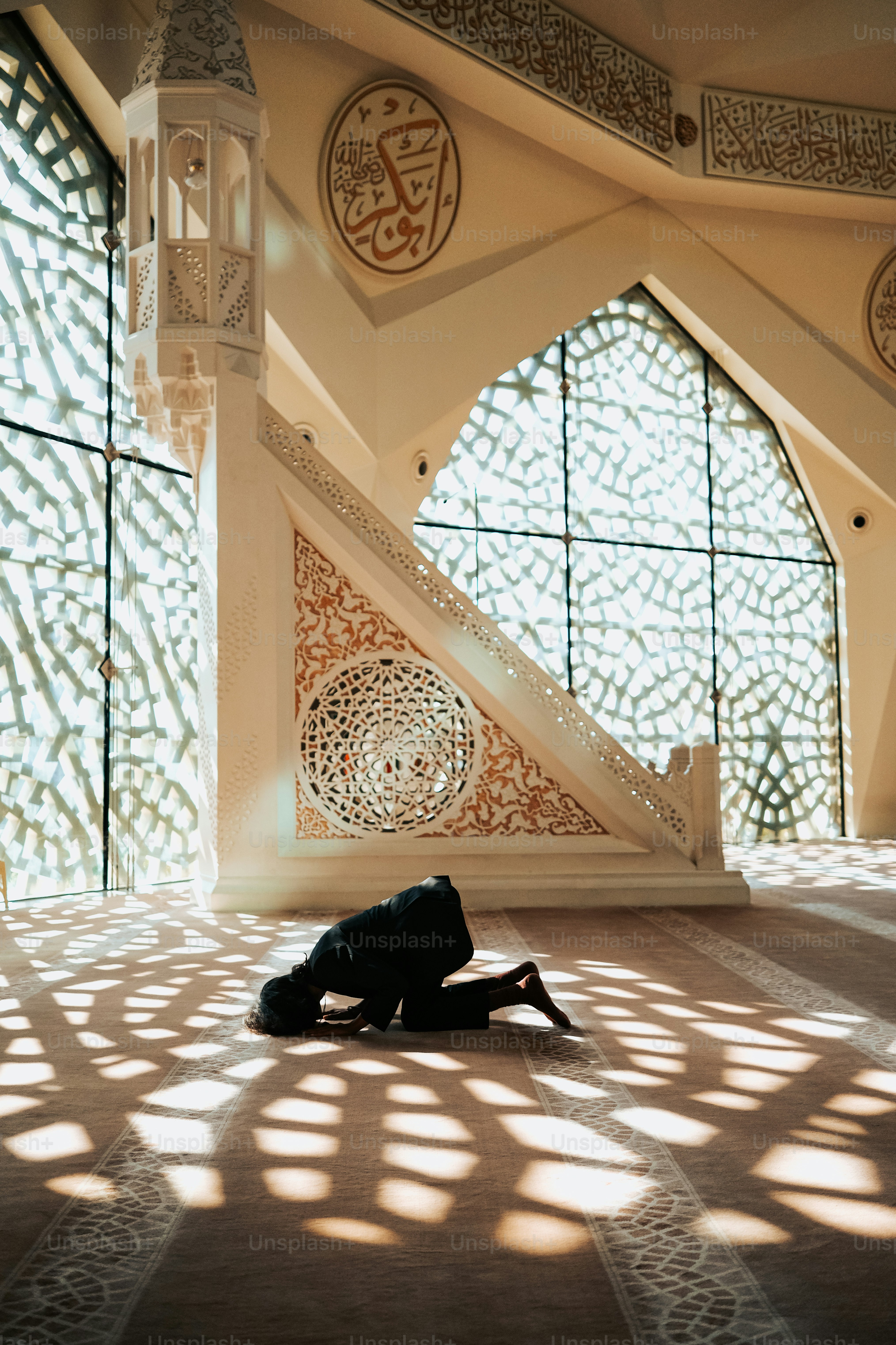 a person laying on the floor in front of a window