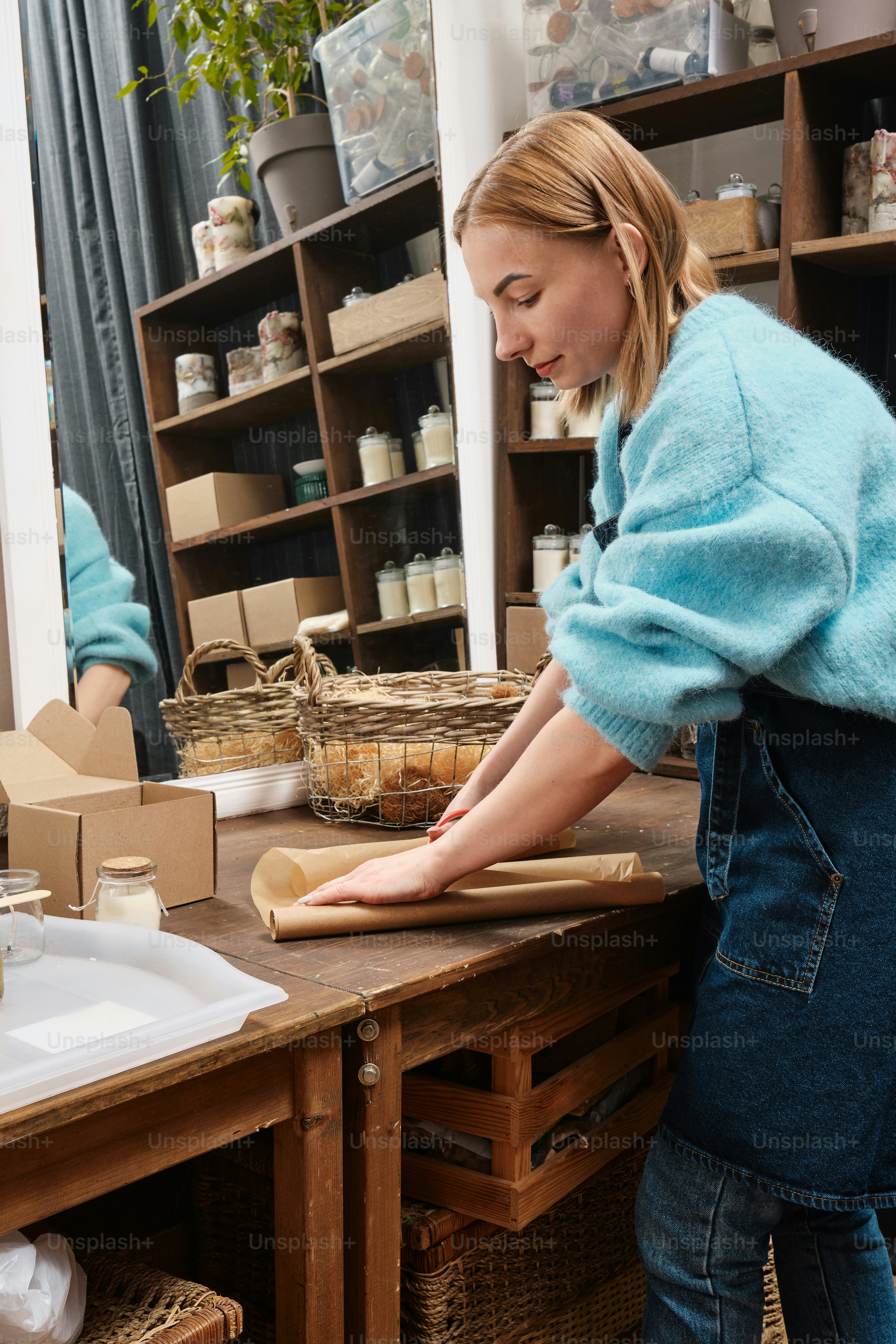 a woman standing in front of a wooden counter