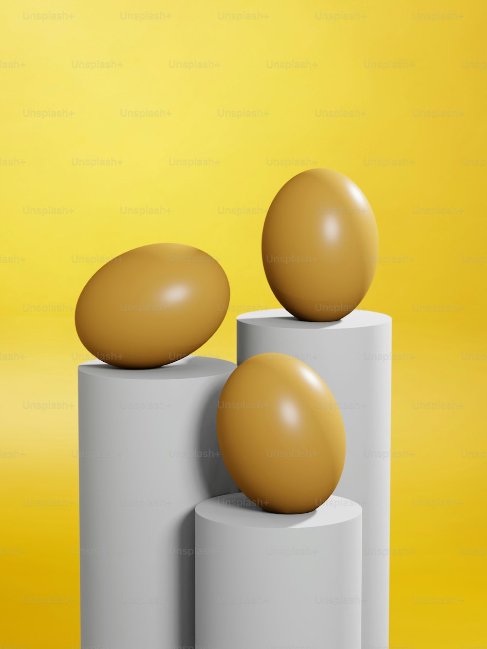 a couple of eggs sitting on top of two cylinders
