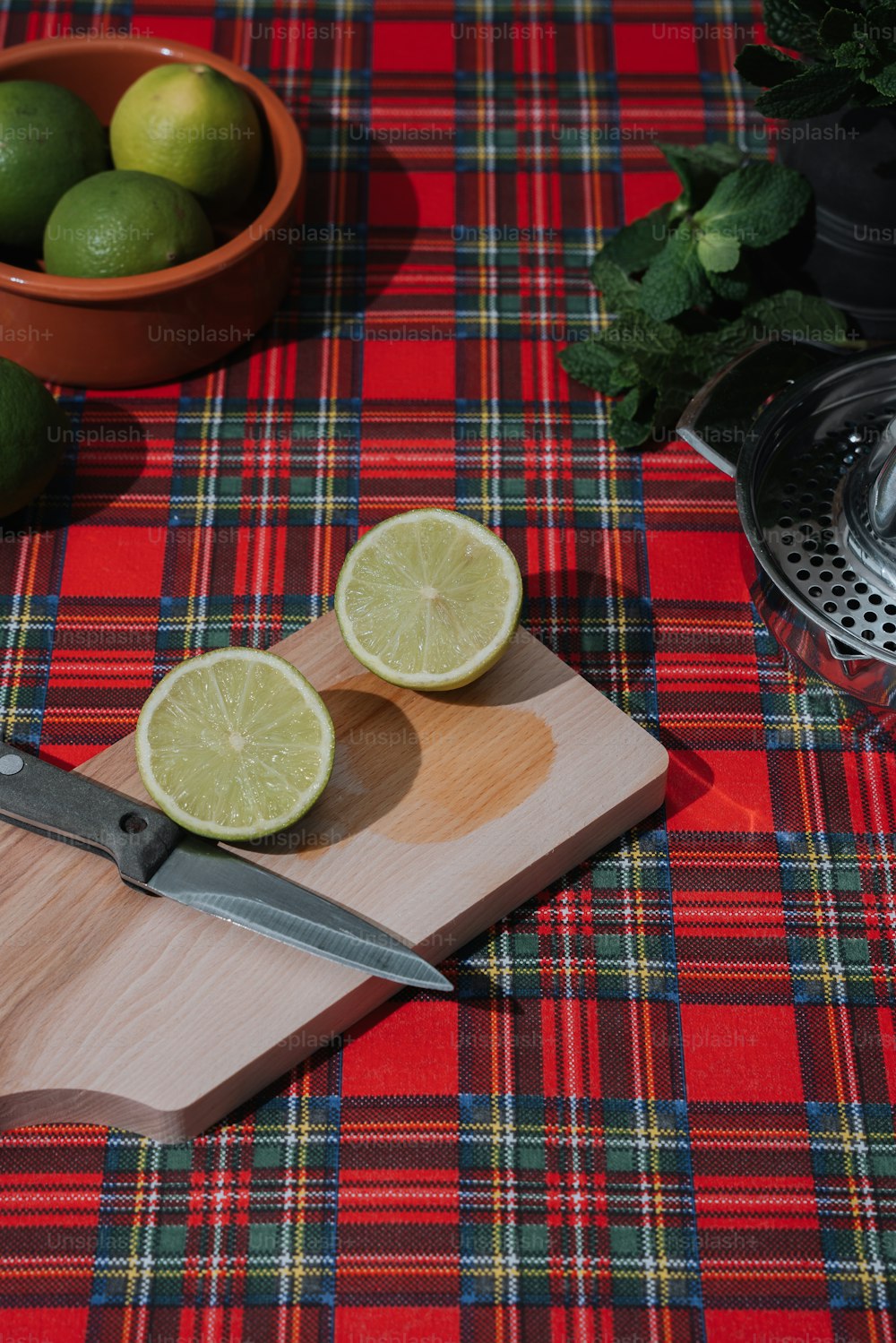 a cutting board with two limes on it