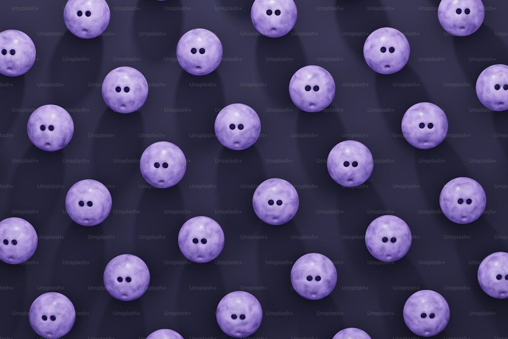 a bunch of purple balls with holes in them