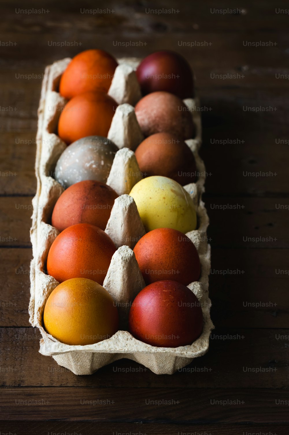 a carton of eggs sitting on top of a wooden table