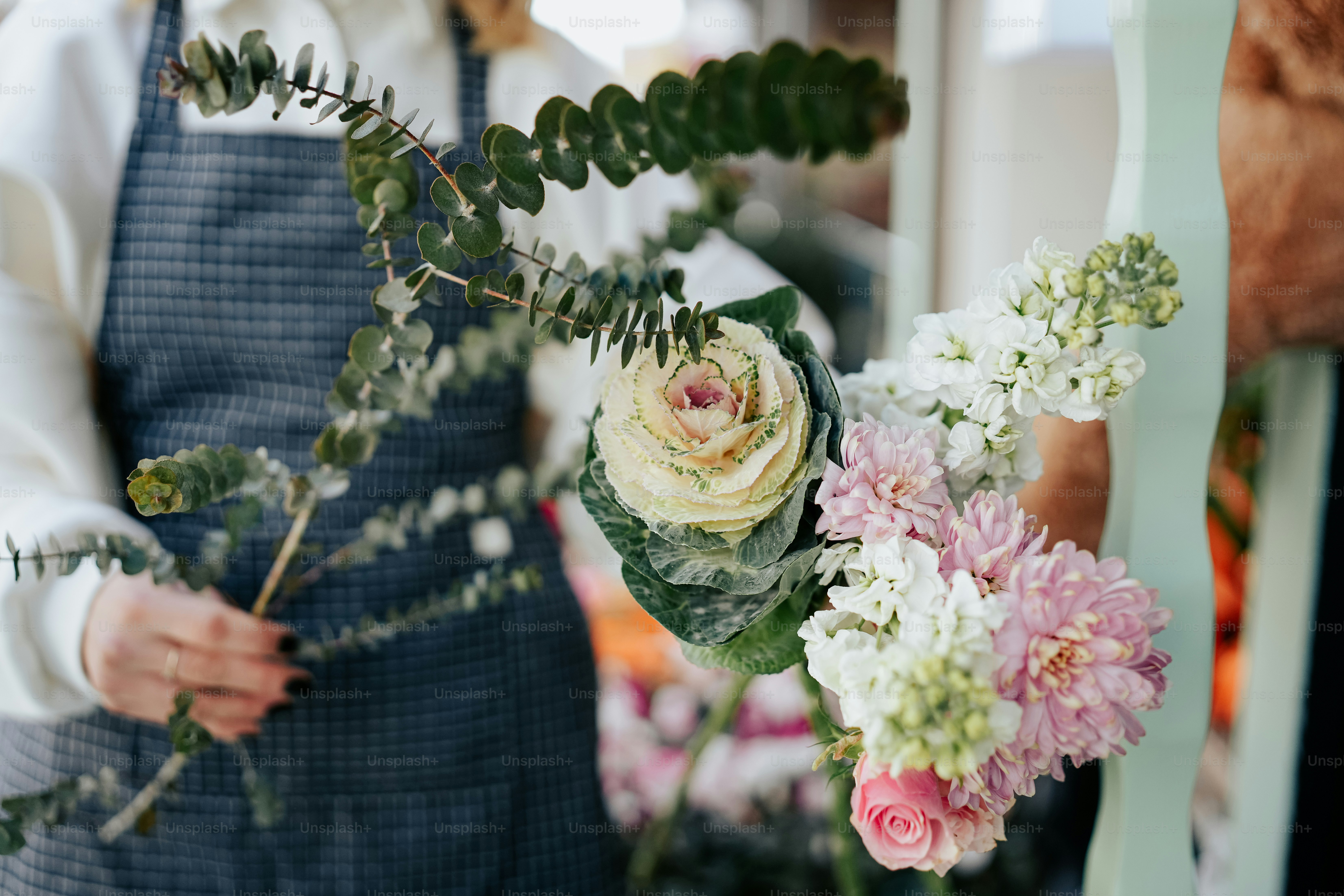 a woman is holding a bouquet of flowers
