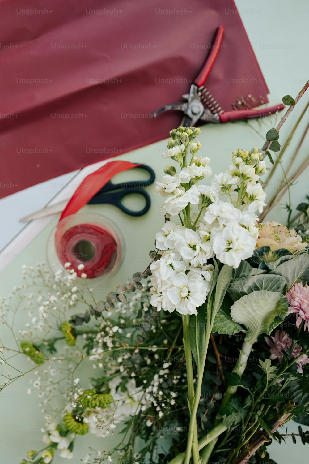 a bunch of flowers sitting on top of a table