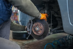 a close up of a person working on a vehicle