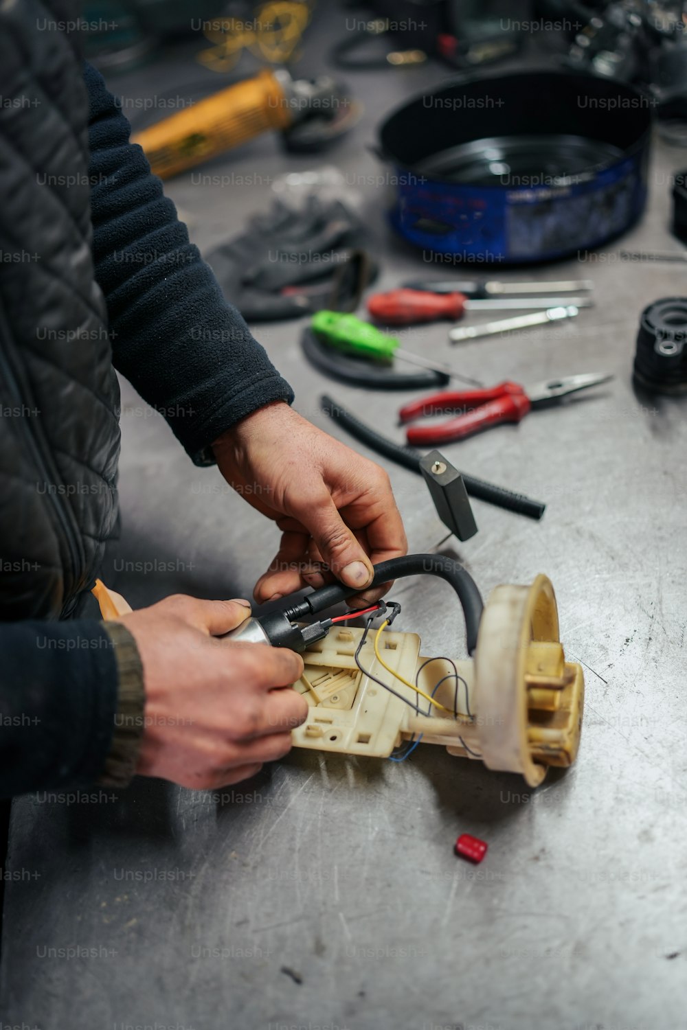 a man is working on a piece of wood