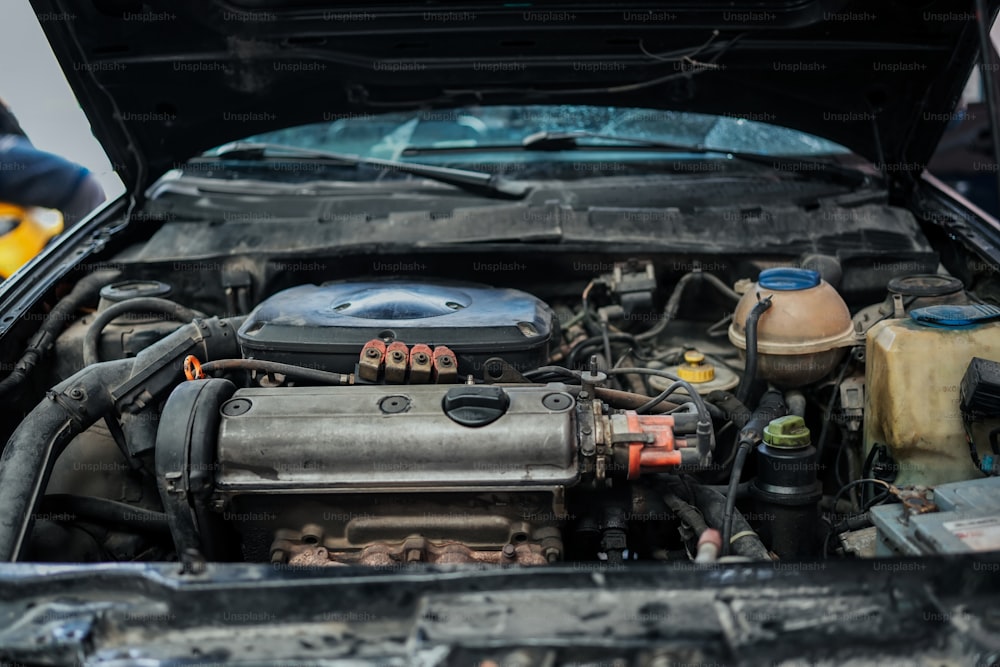 the engine compartment of a car with the hood open