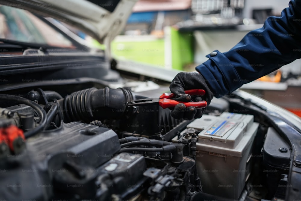 a man is working on a car engine