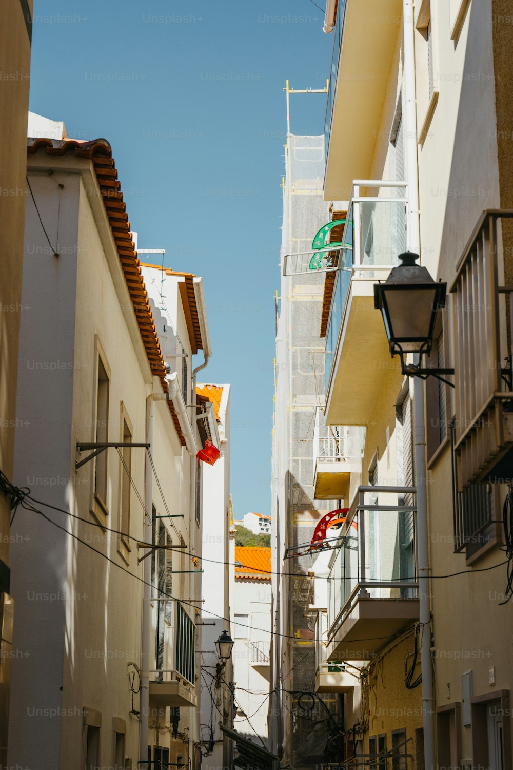a narrow city street with buildings on both sides