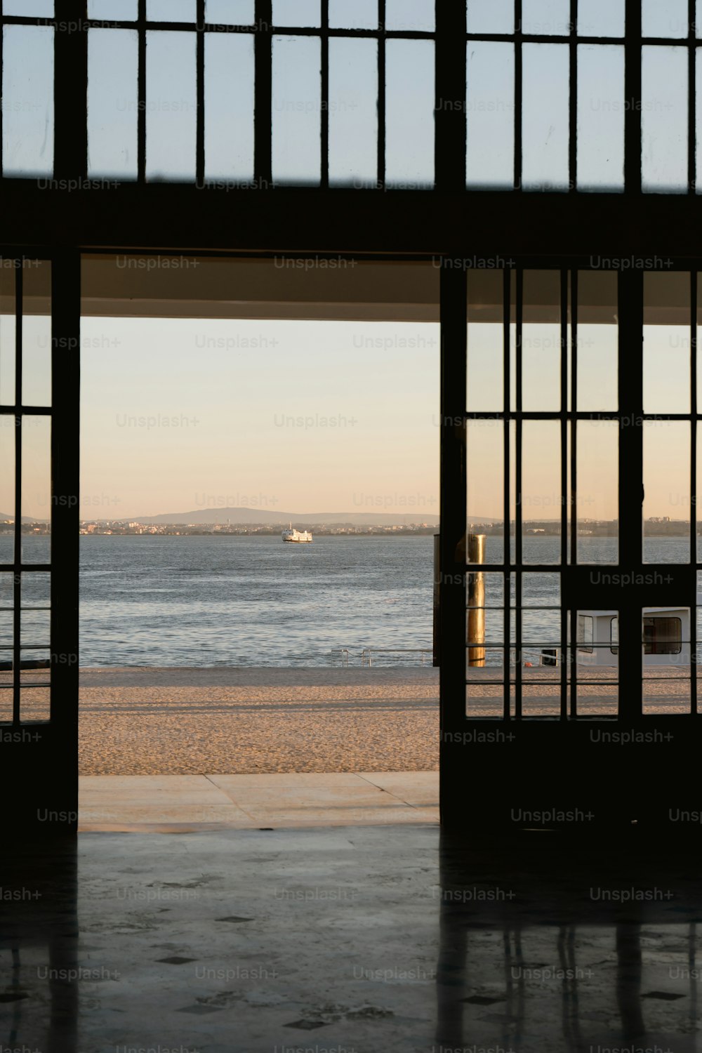 a view of the ocean from inside a building