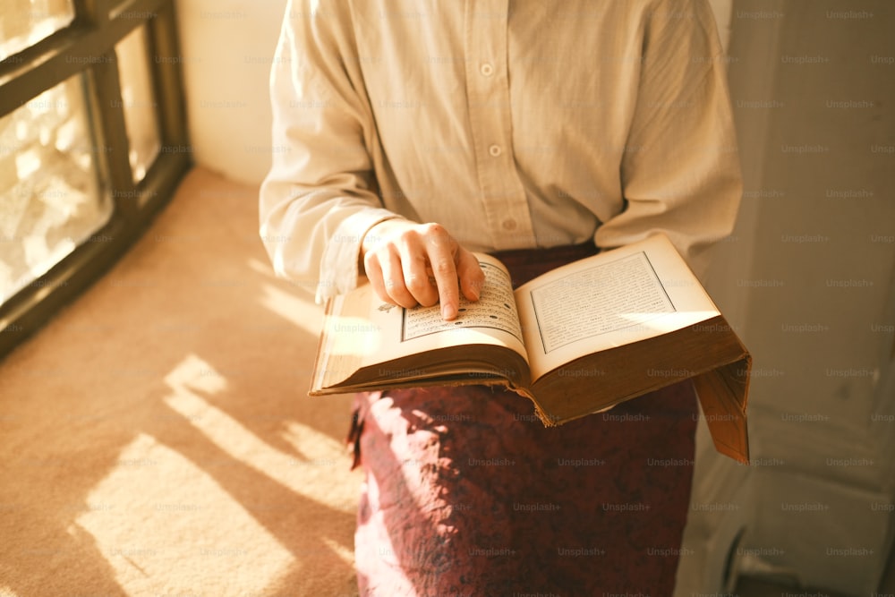 a person holding a book in their hands