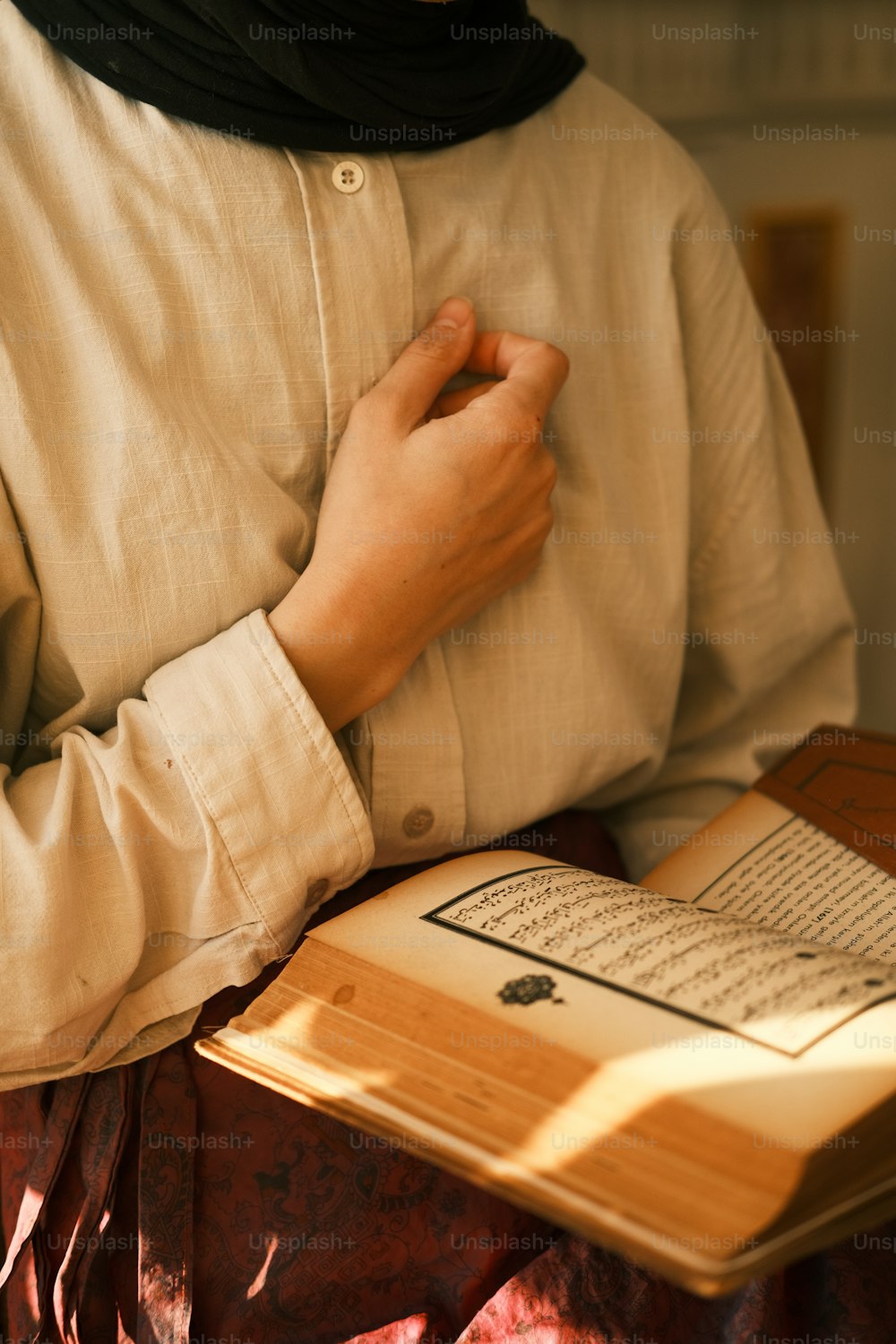 a person holding a book in their hands