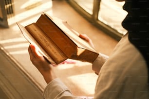 a person holding a book in their hands