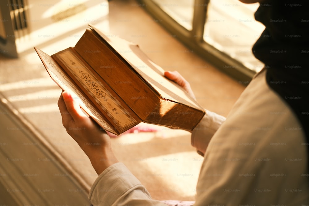 a person holding a book in their hands