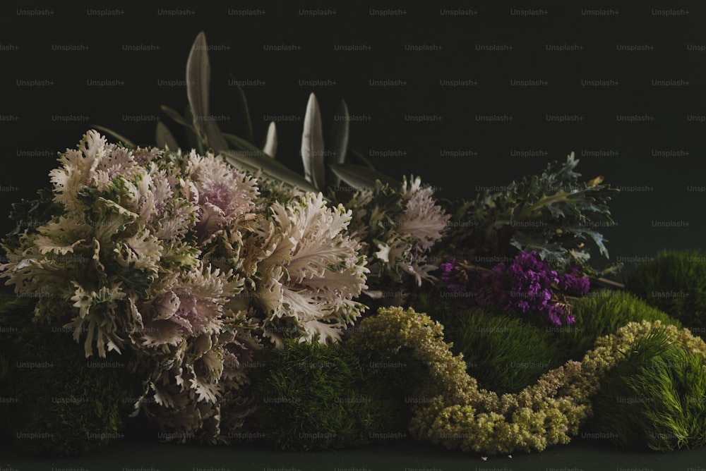 a bunch of flowers sitting on top of a table