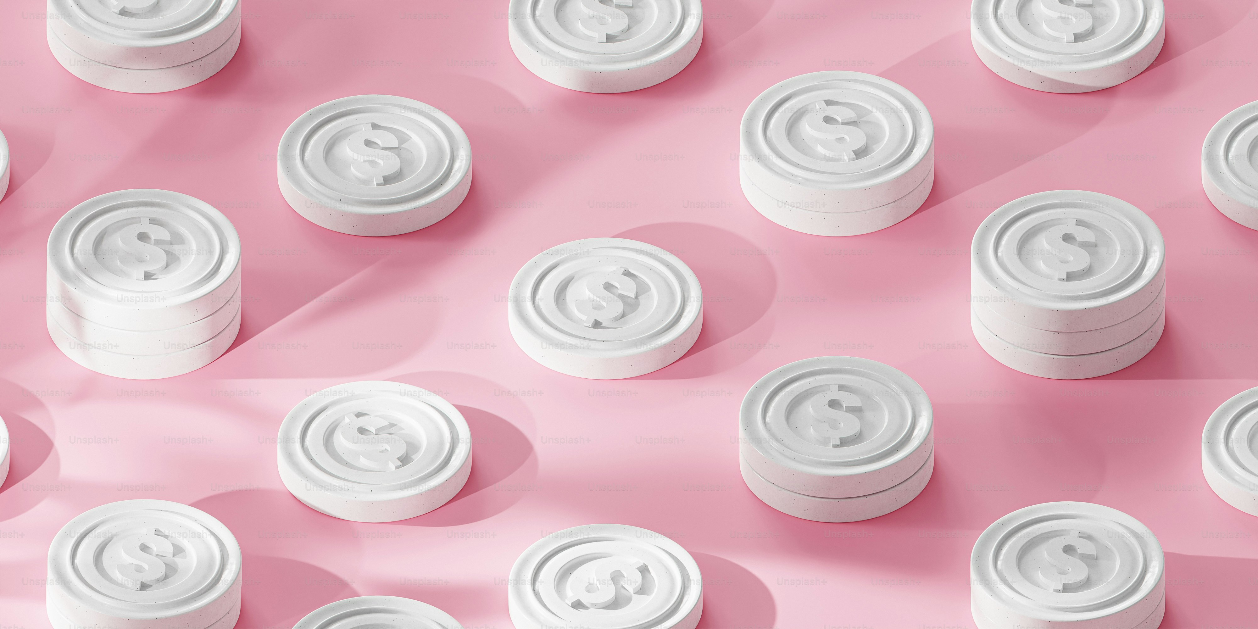 a pink background with a lot of white pills